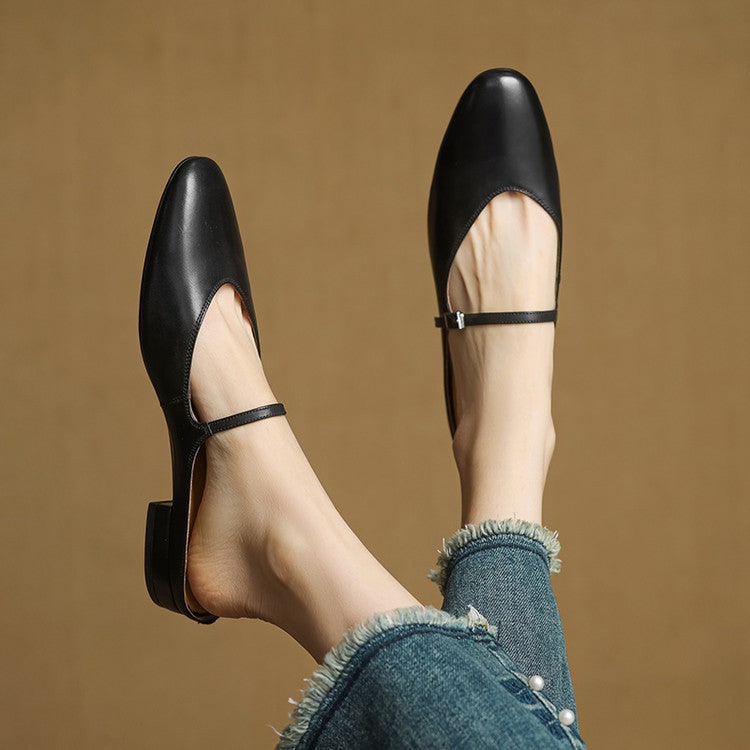 Mules Mary Jane nere con cinturino e punta a mandorla. Classico intramontabile, comodo e chic.
