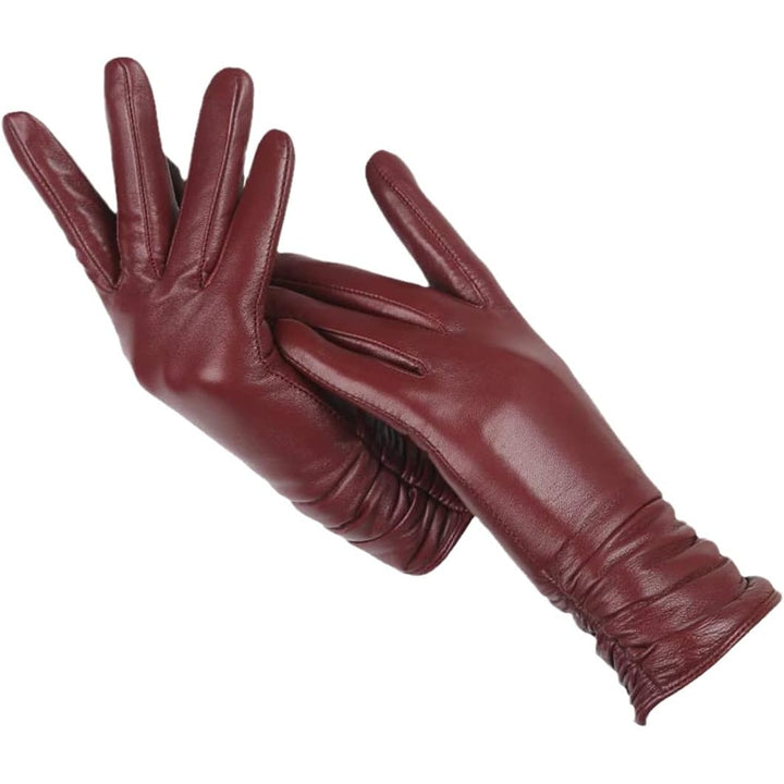 Guanti da donna in pelle per l'inverno, con un distintivo polsino arricciato e morbida fodera in lana.