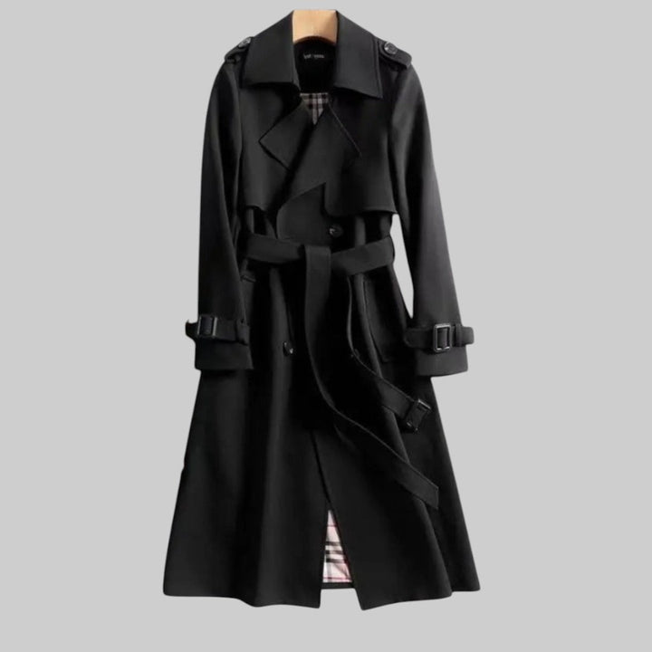 Trench donna autunnale/primaverile, modello lungo doppiopetto. Capo di moda femminile classico ed elegante con cintura.