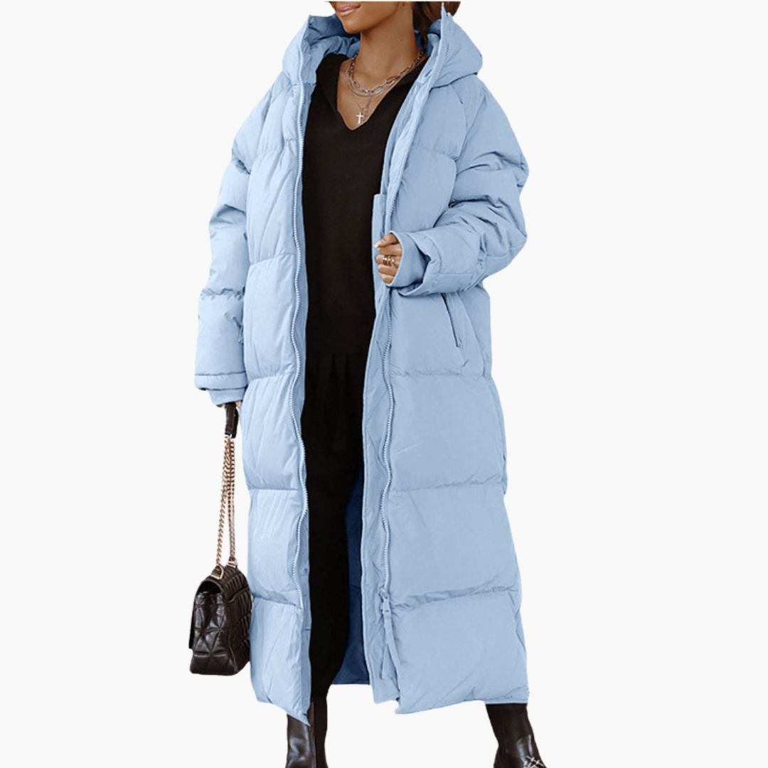 Elegante cappotto piumino lungo donna trapuntato oversize con cappuccio, outerwear invernale per moda casual.