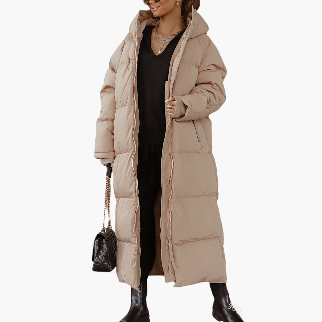 Giacca invernale da donna, piumino lungo trapuntato con cappuccio. Perfetta per uno stile casual e l'inverno.