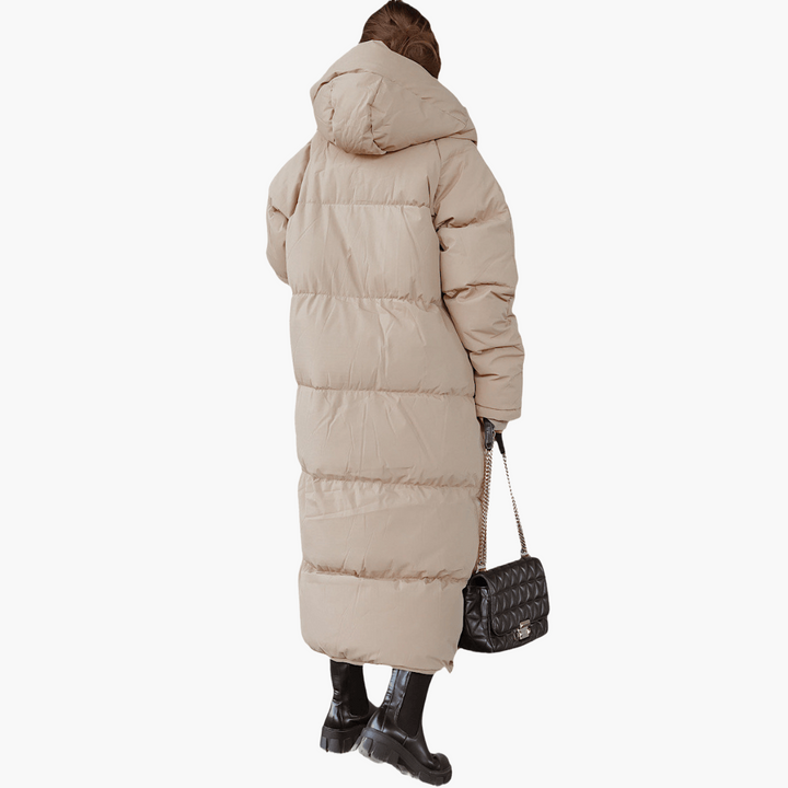 Comodo piumino lungo donna trapuntato con cappuccio, cappotto invernale caldo e oversize per moda donna casual.