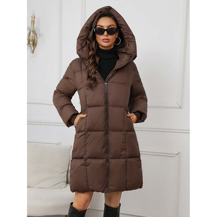 Cappotto donna invernale lungo in piumino trapuntato, elegante e caldo per la stagione fredda.