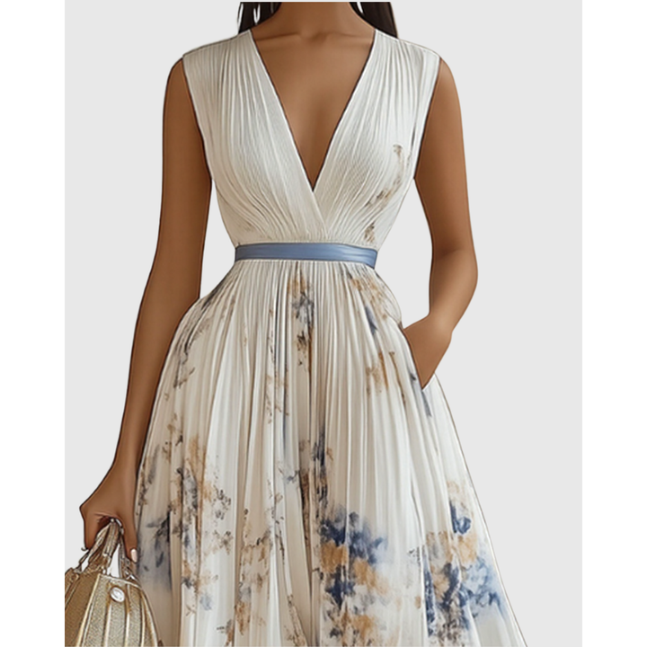 Elegante abito floreale lungo da donna con pieghe e maniche, ideale per serate primaverili.