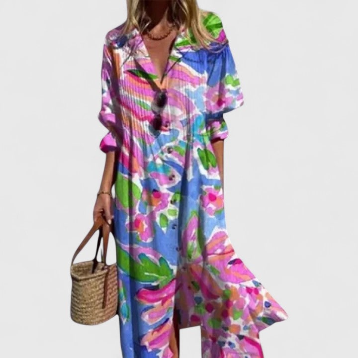 Abito camicia da donna maxi, versatile per look eleganti o casual. Presenta maniche lunghe, pieghe e bottoni.