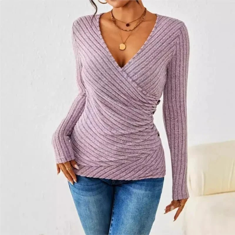 Elegante top avvolgente da donna a maniche lunghe con raffinato drappeggio. Ideale per moda casual chic.