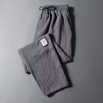 Pantaloni lounge donna casual grigi con vita elastica e coulisse, ideali per relax e tempo libero.