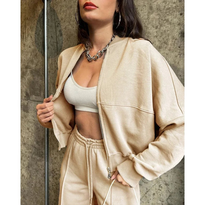 Moda donna: completo tuta oversize 2 pezzi con pantaloni gamba larga e giacca zip. Stile casual e moderno.