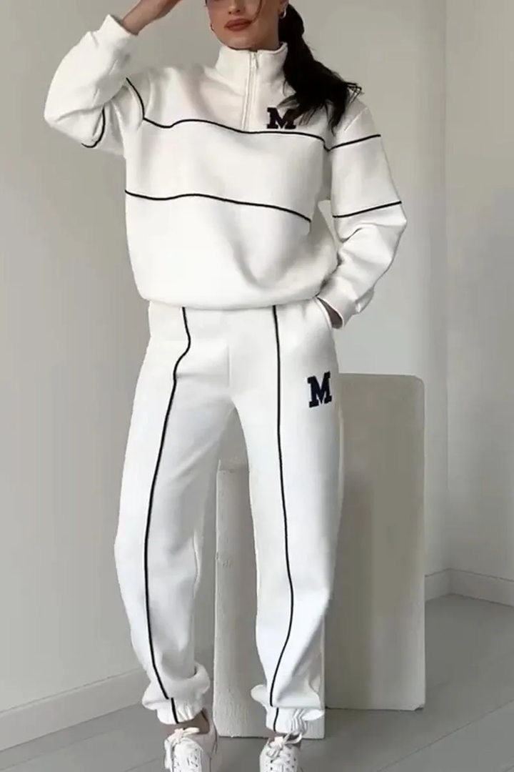 Set athleisure donna elegante: felpa mezza zip e jogger sportivi. Perfetta per casa o tempo libero.