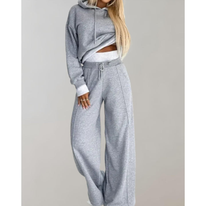 Felpa crop da donna e pantaloni ampi con coulisse per un completo loungewear versatile e alla moda.