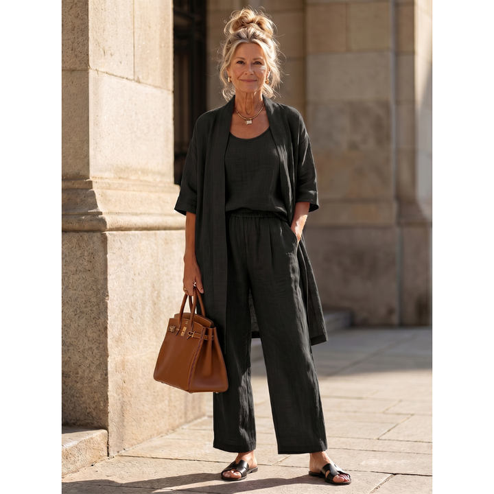 Look completo donna con cardigan lungo e pantaloni a gamba larga. Stile casual ed elegante.