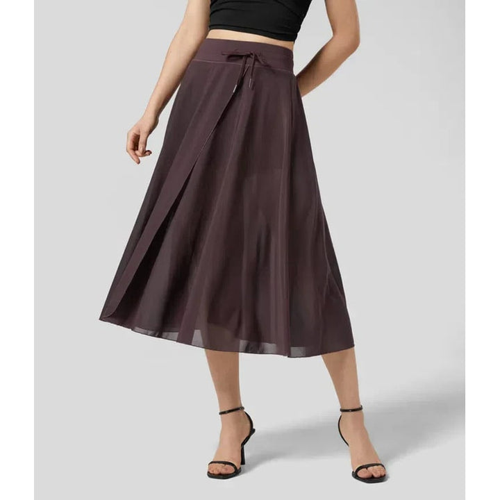Gonna donna elegante, midi trasparente. Vita alta, modello A-line a portafoglio. Perfetta per la sera.