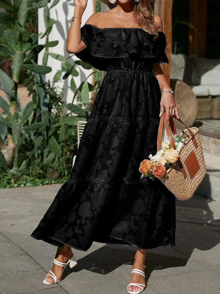 Abito lungo donna elegante jacquard, con volant e spalle scoperte. Look sofisticato per ogni evento importante.