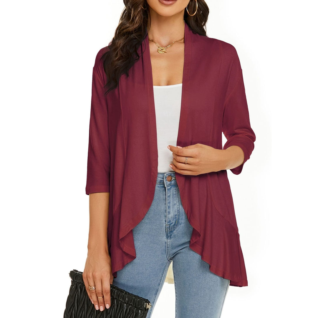 Morbido cardigan donna, aperto, con maniche tre quarti drapeggiate. Perfetto per un look casual.