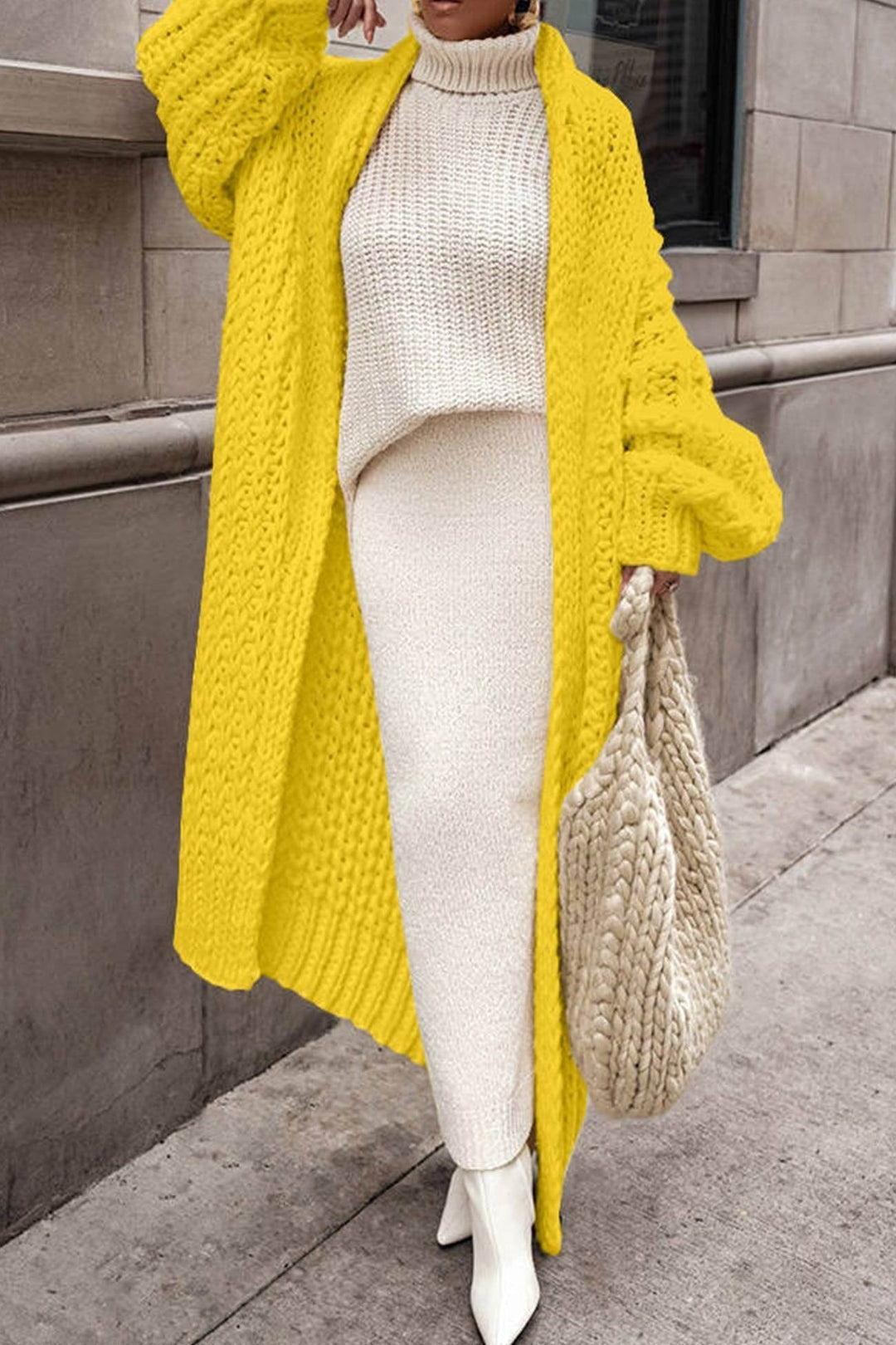Cardigan donna autunnale/invernale, taglio lungo oversize in maglia, aperto, per stile e calore senza sforzo.