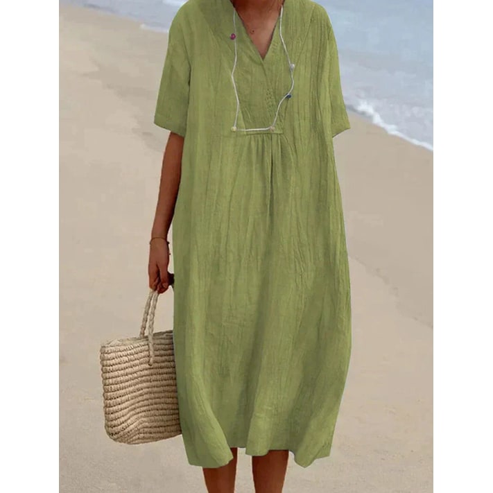 Abito estivo oversize da donna con scollo a V, ideale per vacanze e look casual comodi in città.