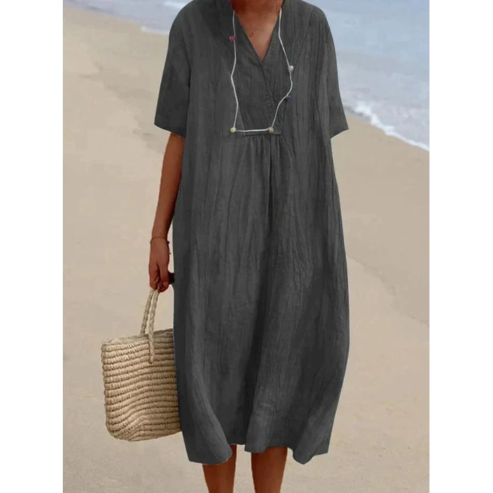 Elegante vestito midi donna oversize scollo a V e manica corta, versatile per l'estate e look casual.