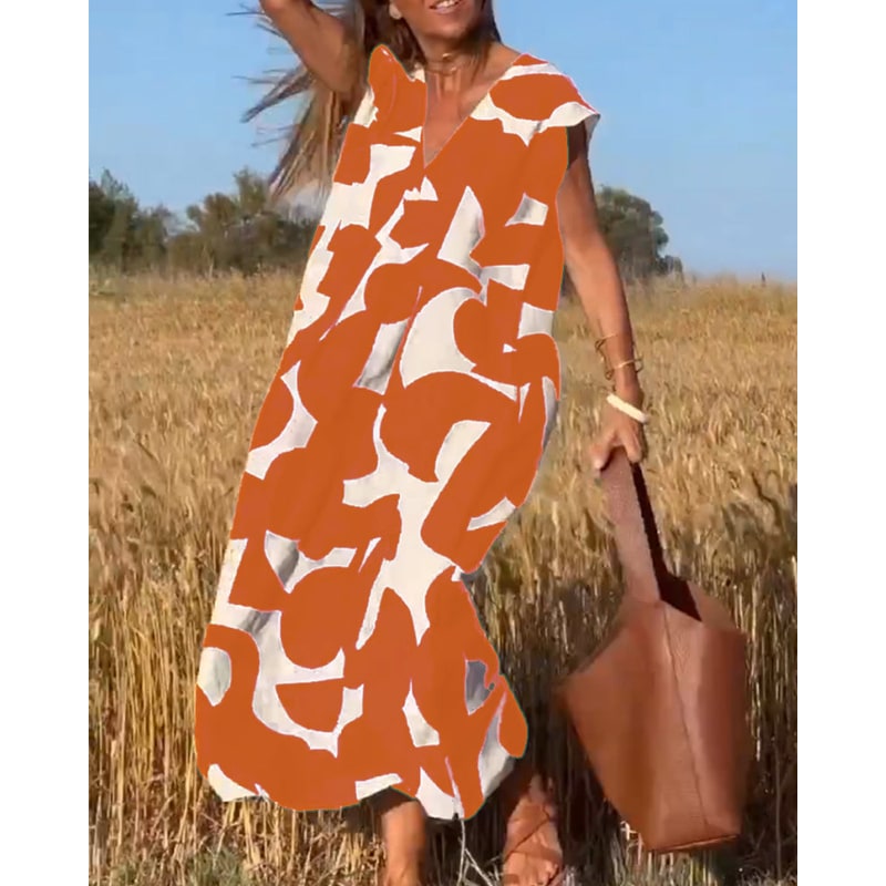 Abito estivo stampato da donna con scollo a V e maniche ad aletta. Look chic, comodo ed elegante per l'estate.
