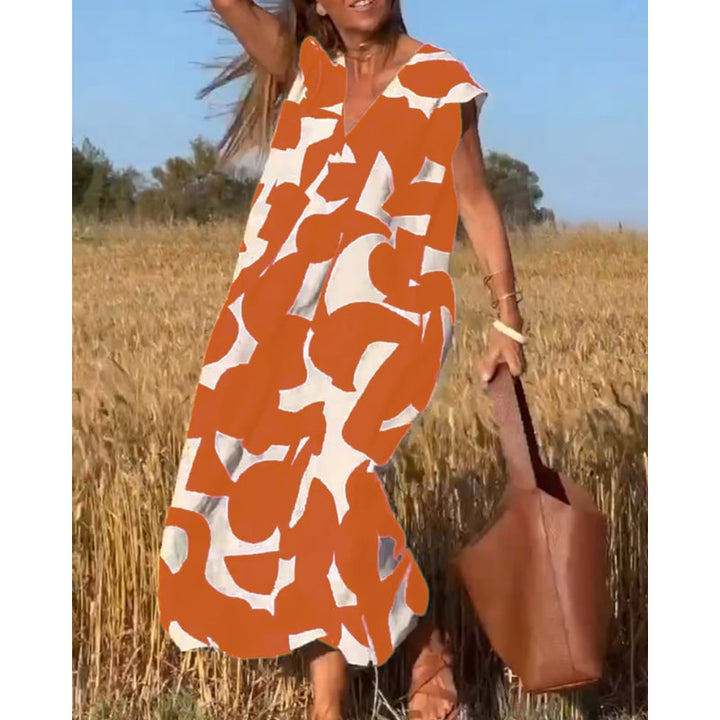 Abito estivo stampato da donna con scollo a V e maniche ad aletta. Look chic, comodo ed elegante per l'estate.