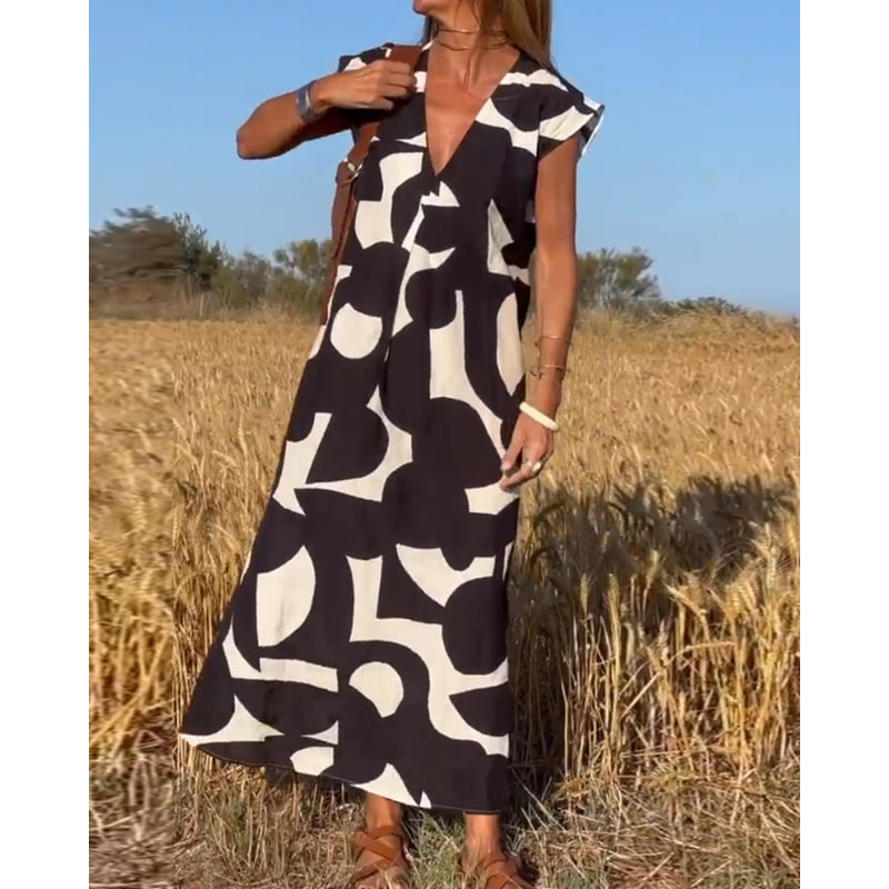 Abito lungo estivo donna elegante, fantasia colorata, scollo a V, maniche ad aletta. Ideale per la moda.