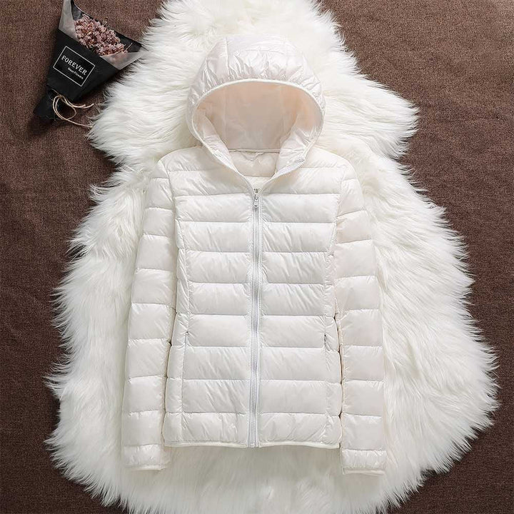 Piumino da donna con zip e cappuccio, giacca trapuntata, autunno/inverno, per un outfit elegante.