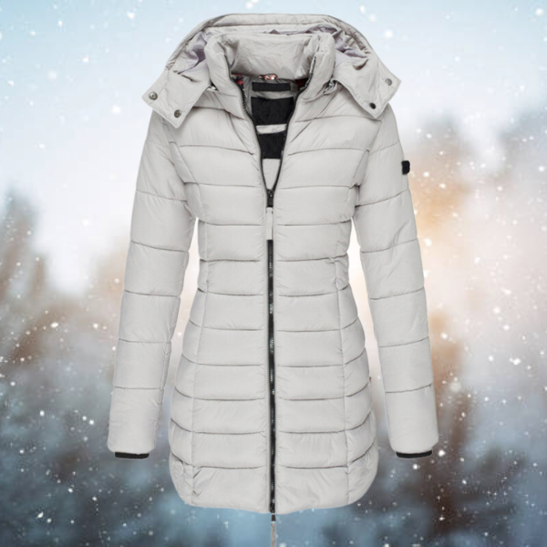 Piumino da donna trapuntato lungo, con cappuccio e cerniera. Stile e calore per l'abbigliamento invernale.