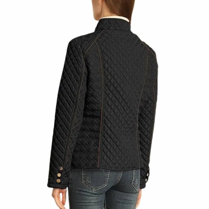 Elegante giacca da donna trapuntata con piping a contrasto che esalta il design. Perfetta per look sofisticati.