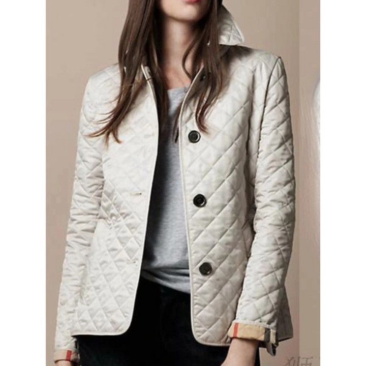 Cappotto leggero da donna, trapuntato, con collo risvoltato e dettagli moda. Perfetto per l'autunno.