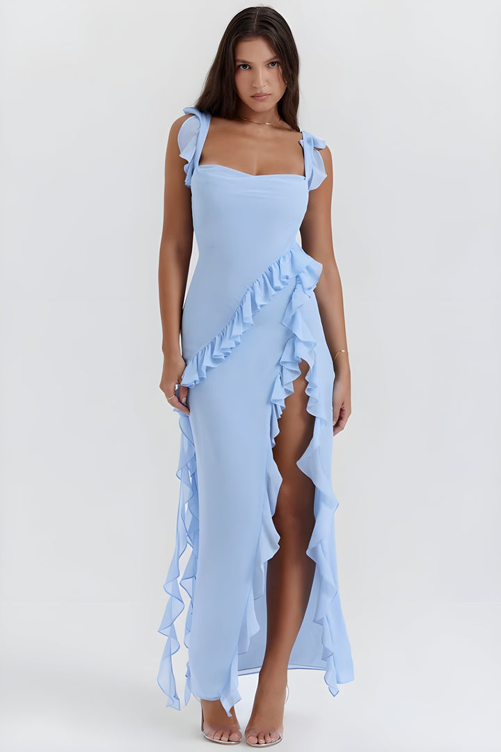Abito da sera donna, lungo, elegante, con balze voluminose e spacco per un look glamour.