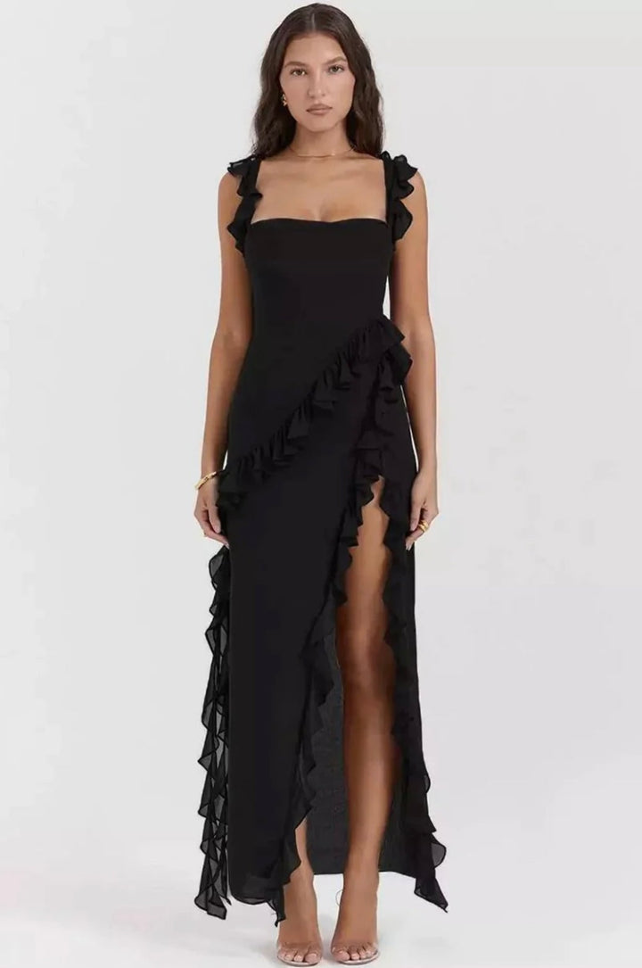Look formale: abito lungo donna elegante, con balze decorative e spacco sulla coscia.