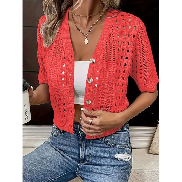 Cardigan corto donna con maniche corte, scollo a V e lavorazione pointelle. Versatile e leggero.