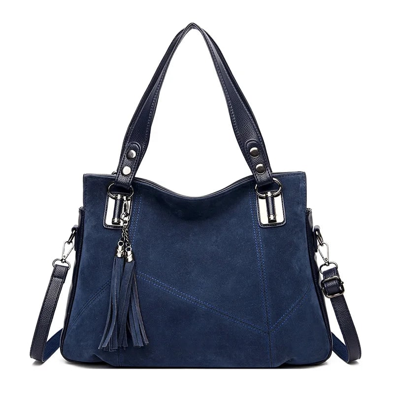 Borsa a spalla strutturata, mix di texture in pelle e camoscio. Un accessorio moda donna indispensabile.