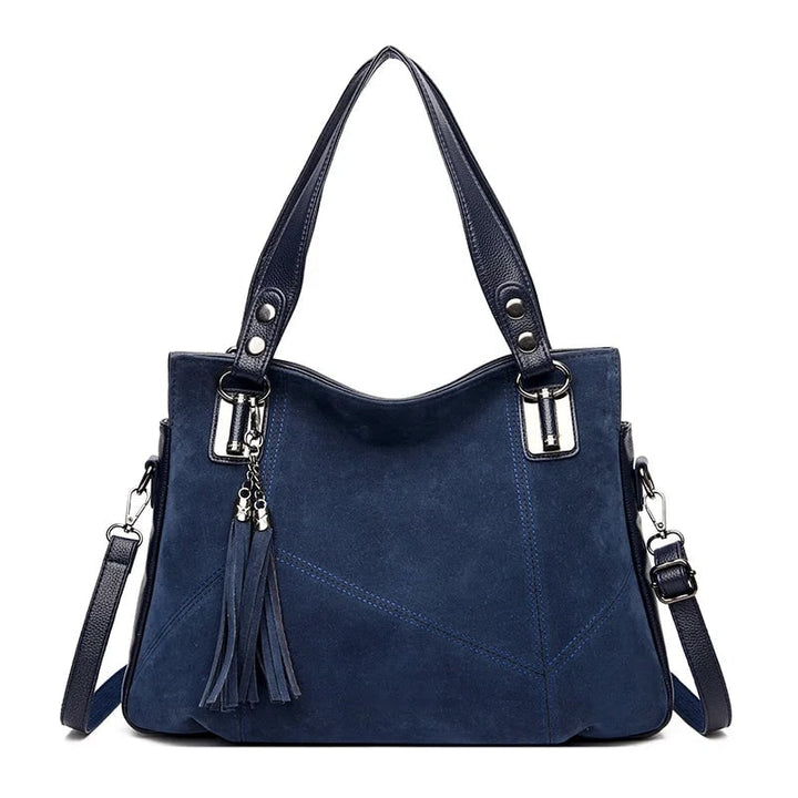 Borsa a spalla strutturata, mix di texture in pelle e camoscio. Un accessorio moda donna indispensabile.