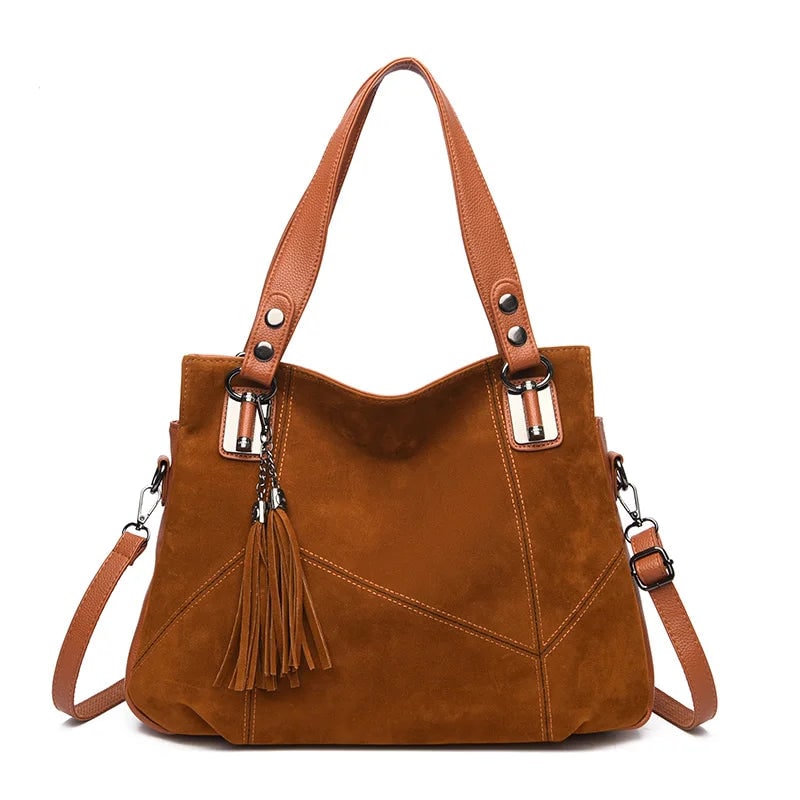 Borsa a spalla elegante e strutturata, in pregiata pelle e camoscio. Per un look sofisticato donna.