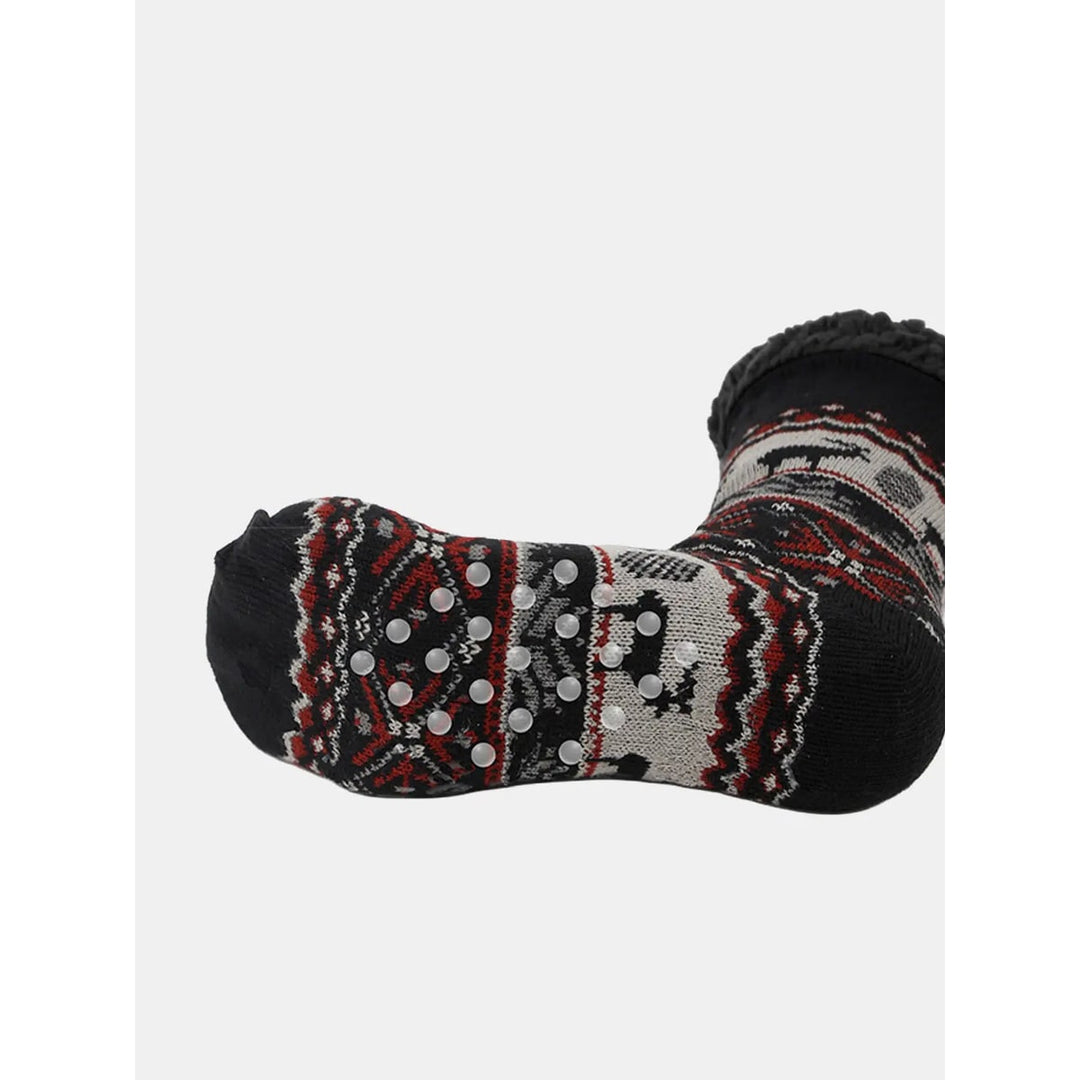 Calze pantofola invernali donna con motivo renna Fair Isle, antiscivolo e calde, perfette per il relax.