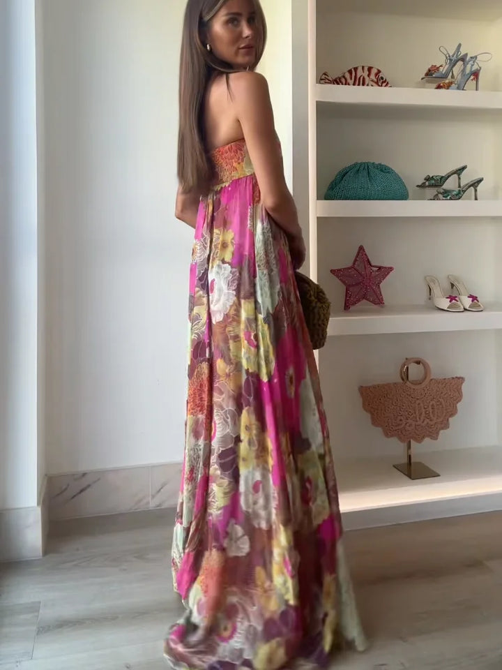 Abito lungo donna con bustier e scollo a cuore, vista laterale, stampa floreale delicata.