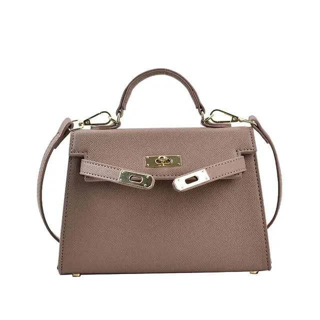 Borsa da donna strutturata, un must-have per la moda attuale. Manico, tracolla e chiusura girello dorata per stile chic.