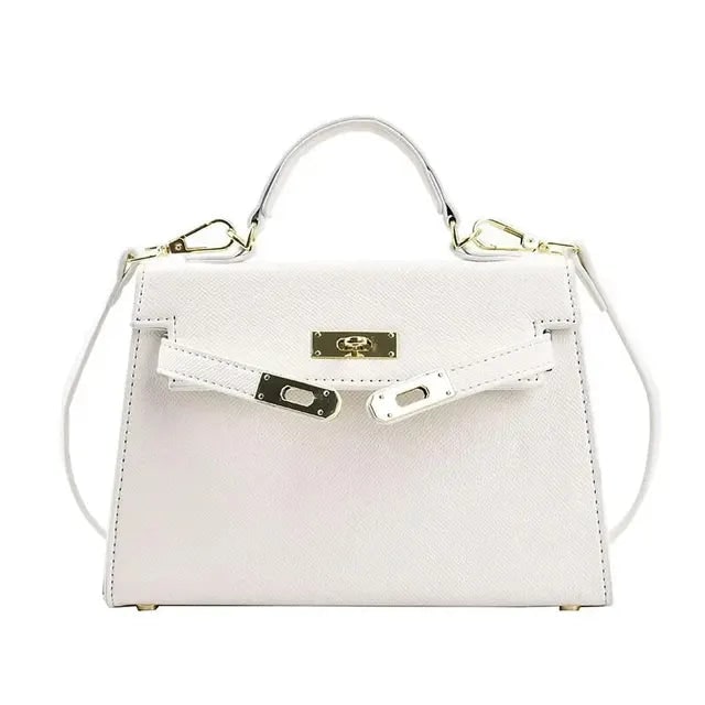 Borsa strutturata da donna, perfetta forma rigida con manico superiore e tracolla versatile. Dettaglio chiusura dorata chic.