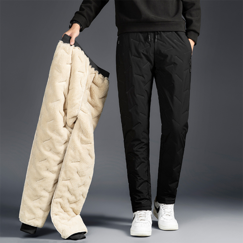 Pantaloni termici impermeabili da donna neri con coulisse, ideali per inverno e attività outdoor.