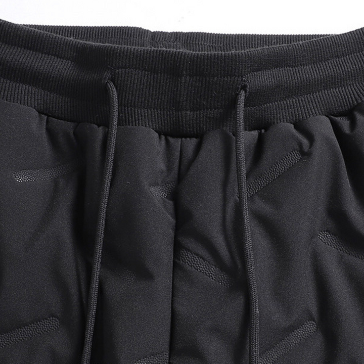 Pantaloni sportivi da donna, impermeabili e caldi, ideali per jogging e attività outdoor invernali.