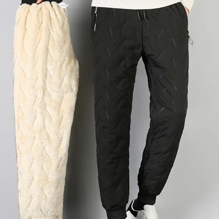 Dettaglio della coulisse su pantaloni jogger termici impermeabili da donna, vestibilità regolabile.