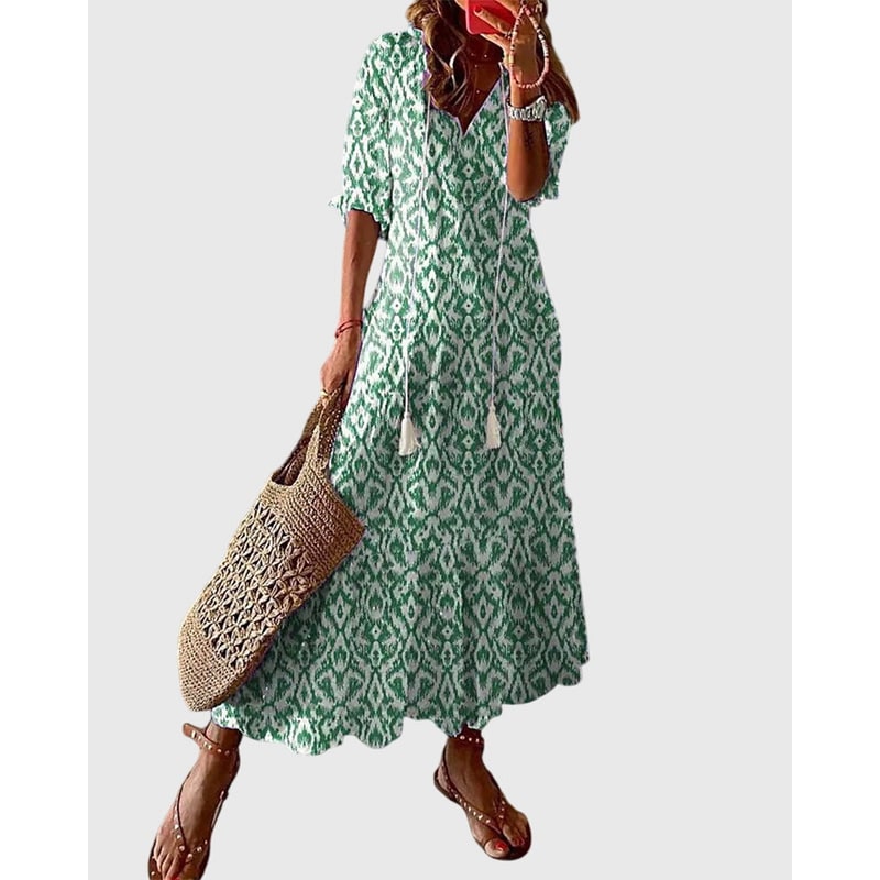 Abito maxi estivo boho chic da donna con scollo a V e balze fluide. Perfetto per look casual elegante.