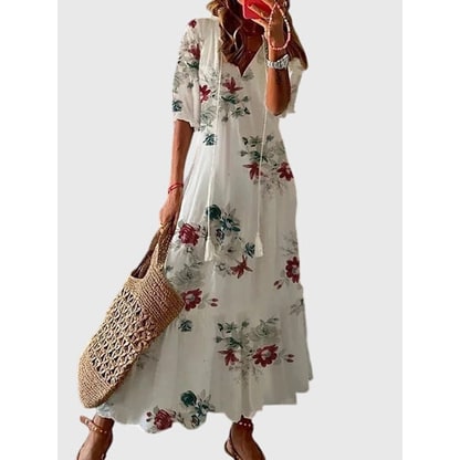 Moda donna: abito estivo boho chic con scollo a V e balze. Un maxi dress versatile e comodo per ogni giorno.