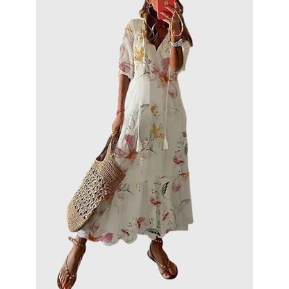 Abito estivo lungo donna, taglio boho chic con scollo a V e balze. Comodo e stiloso per spiaggia e città.