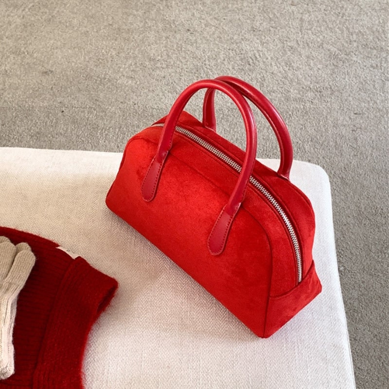 Borsa a mano verde strutturata da donna. Accessorio classico ed elegante con chiusura a zip per outfit vari.