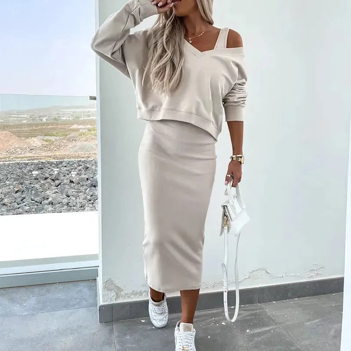 Completo due pezzi donna con vestito midi aderente e top corto. Stile chic e contemporaneo per la donna moderna.