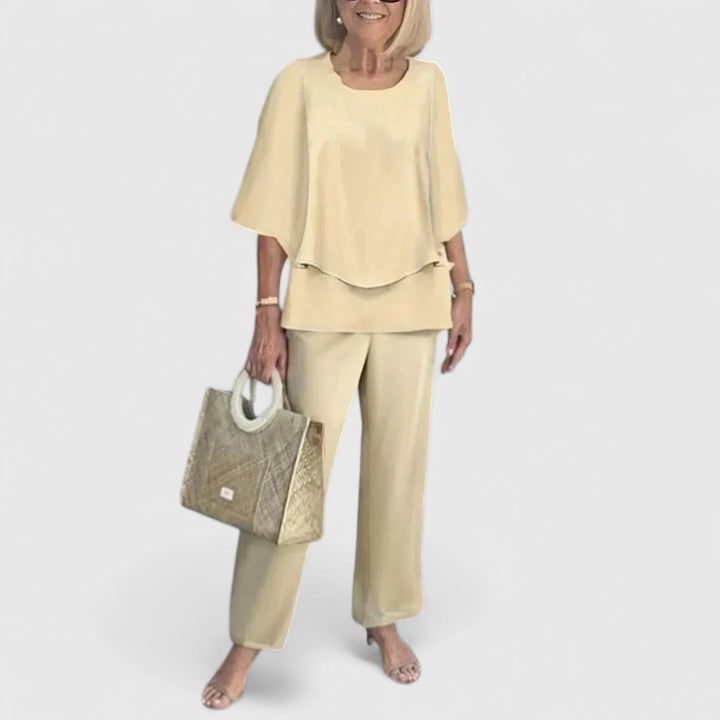 Completo pantaloni donna, tunica a strati e collo rotondo. Moda versatile per abbigliamento casual chic.