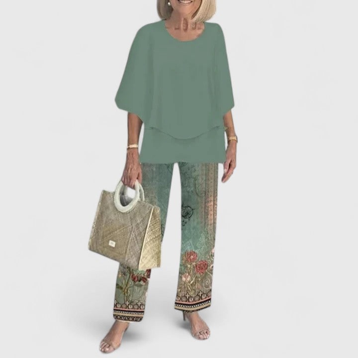 Outfit donna versatile: set due pezzi con tunica a strati e pantaloni gamba dritta. Stile elegante e casual.