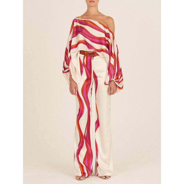 Completo due pezzi donna elegante, top spalle scoperte e pantaloni gamba larga. Perfetto per un look chic.