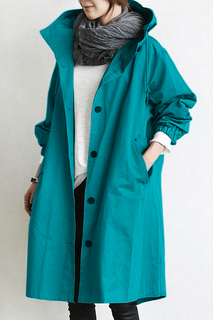 Parka trench impermeabile da donna, un capo essenziale con cappuccio e coulisse per un look casual e alla moda.